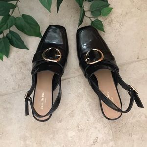 Black loafer with slight heel